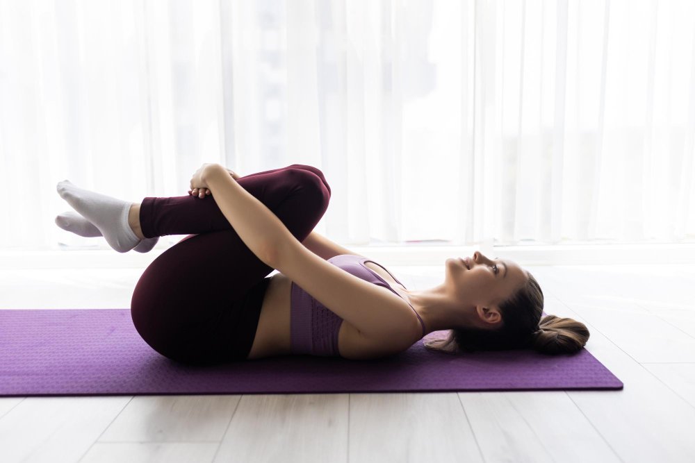 Winter Slimdown 15 Belly-Blasting Yoga Poses Pavanamuktasana (Wind-Relieving Pose)