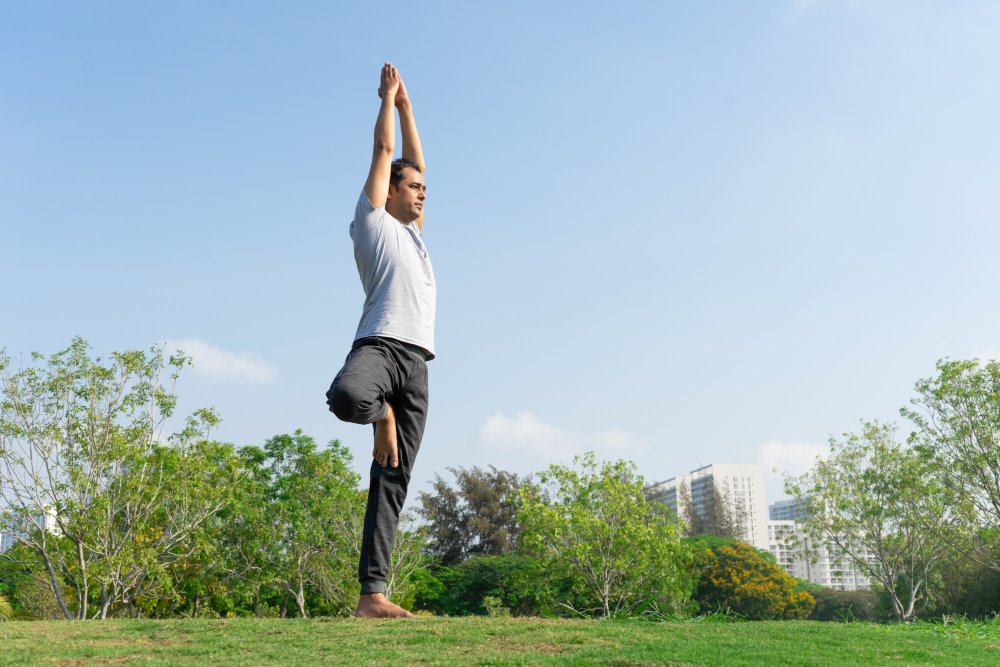 Winter Slimdown 15 Belly-Blasting Yoga Poses Vrikshasana (Tree Pose)